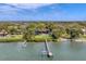 Wide aerial showcasing the house, dock, and waterfront location at 603 Harbor Shore Dr, Nokomis, FL 34275