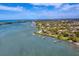 Expansive aerial view of waterfront homes and coastline at 603 Harbor Shore Dr, Nokomis, FL 34275
