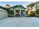 House exterior at sunset with a gravel driveway at 603 Harbor Shore Dr, Nokomis, FL 34275