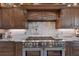 Gourmet kitchen with stainless steel appliances and granite countertops at 603 Harbor Shore Dr, Nokomis, FL 34275