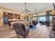 Open living space with hardwood floors, fireplace and access to a relaxing patio at 603 Harbor Shore Dr, Nokomis, FL 34275