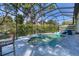 Inviting screened pool with spa and lounge area at 603 Harbor Shore Dr, Nokomis, FL 34275