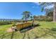 Landscaped waterfront lot with a unique stone feature at 603 Harbor Shore Dr, Nokomis, FL 34275