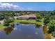 Aerial view of house and pond at 644 Rivendell Blvd, Osprey, FL 34229