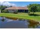 Aerial view of house, landscape and pond at 644 Rivendell Blvd, Osprey, FL 34229