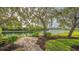 Brick patio overlooking a tranquil lake at 644 Rivendell Blvd, Osprey, FL 34229