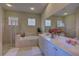 Primary bathroom with double vanity, soaking tub, and a separate shower at 644 Rivendell Blvd, Osprey, FL 34229