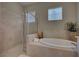 Relaxing bathroom with soaking tub and shower at 644 Rivendell Blvd, Osprey, FL 34229