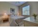 Comfortable bedroom with window and nightstand at 644 Rivendell Blvd, Osprey, FL 34229
