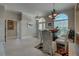 Spacious dining area with light tile floors and a glass-top dining table at 644 Rivendell Blvd, Osprey, FL 34229