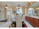 Spacious dining area featuring a glass-top table and elegant chandelier at 644 Rivendell Blvd, Osprey, FL 34229