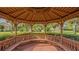 Community gazebo with wooden benches, offering a shaded seating area at 644 Rivendell Blvd, Osprey, FL 34229