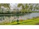 Serene lake view in a private community at 644 Rivendell Blvd, Osprey, FL 34229