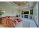 Spacious living room with fireplace, large sectional sofa, and access to the backyard at 644 Rivendell Blvd, Osprey, FL 34229