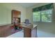 Home office with built-in desk and window at 644 Rivendell Blvd, Osprey, FL 34229