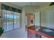 Home office with view of backyard and pond at 644 Rivendell Blvd, Osprey, FL 34229