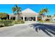 Community center building with palm trees at 653 Cedars Ct, Longboat Key, FL 34228