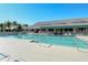 Community swimming pool with lounge chairs at 653 Cedars Ct, Longboat Key, FL 34228