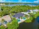 Aerial view showcasing home's waterfront location and pool at 6530 Peacock Rd, Sarasota, FL 34242