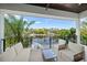 Relaxing balcony overlooking a canal with comfortable seating at 6530 Peacock Rd, Sarasota, FL 34242