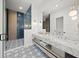 Spa-like bathroom with double vanity and marble countertop at 6530 Peacock Rd, Sarasota, FL 34242