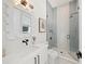 Modern bathroom with a white vanity and a walk-in shower at 6530 Peacock Rd, Sarasota, FL 34242