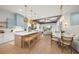 Modern kitchen with a large island and light blue cabinets at 6530 Peacock Rd, Sarasota, FL 34242