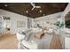 Spacious living room with curved sofa and open floor plan at 6530 Peacock Rd, Sarasota, FL 34242