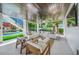 Relaxing outdoor patio with comfortable seating and pool view at 6530 Peacock Rd, Sarasota, FL 34242