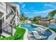 Resort-style pool with a slide and waterfront views at 6530 Peacock Rd, Sarasota, FL 34242