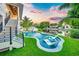 Relaxing pool area with a view of the canal at sunset at 6530 Peacock Rd, Sarasota, FL 34242