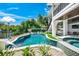 Stunning pool with spa and a view of the canal at 6530 Peacock Rd, Sarasota, FL 34242