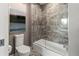 Modern bathroom with a soaking tub and glass shower door at 711 S Palm Ave # 303, Sarasota, FL 34236