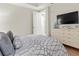 Comfortable bedroom with a dresser and flat screen TV at 711 S Palm Ave # 303, Sarasota, FL 34236