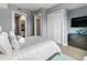Spacious bedroom with a queen-size bed and en-suite bathroom at 711 S Palm Ave # 303, Sarasota, FL 34236