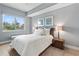 Bright bedroom with a queen-size bed and wood floors at 711 S Palm Ave # 303, Sarasota, FL 34236