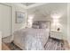 Bright bedroom with double bed and stylish decor at 711 S Palm Ave # 303, Sarasota, FL 34236