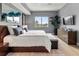 Spacious bedroom with king-size bed, hardwood floors and large window at 711 S Palm Ave # 303, Sarasota, FL 34236
