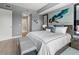 Elegant bedroom with king-size bed, en-suite bathroom access, and hardwood floors at 711 S Palm Ave # 303, Sarasota, FL 34236