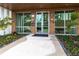 Modern building entrance with glass doors at 711 S Palm Ave # 303, Sarasota, FL 34236
