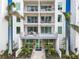 Modern building with multiple balconies and palm trees at 711 S Palm Ave # 303, Sarasota, FL 34236