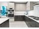 Modern kitchen with stainless steel appliances and white cabinets at 711 S Palm Ave # 303, Sarasota, FL 34236