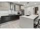 Modern kitchen with stainless steel appliances and large island at 711 S Palm Ave # 303, Sarasota, FL 34236