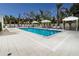 Resort-style pool with ample lounge chairs and shade structures at 711 S Palm Ave # 303, Sarasota, FL 34236