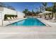 Relaxing pool area with shaded seating and lounge chairs at 711 S Palm Ave # 303, Sarasota, FL 34236