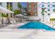 Community pool and building exterior view at 711 S Palm Ave # 303, Sarasota, FL 34236