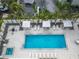 Inviting community pool with lounge chairs and shade structures at 711 S Palm Ave # 303, Sarasota, FL 34236