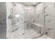 Large walk-in shower with marble tile and glass enclosure at 711 S Palm Ave # 303, Sarasota, FL 34236