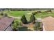Landscaped backyard with lush greenery and golf course view at 7486 Divot Loop # 7486, Bradenton, FL 34202