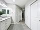 Bright bathroom with a single vanity, and access to hallway at 7486 Divot Loop # 7486, Bradenton, FL 34202